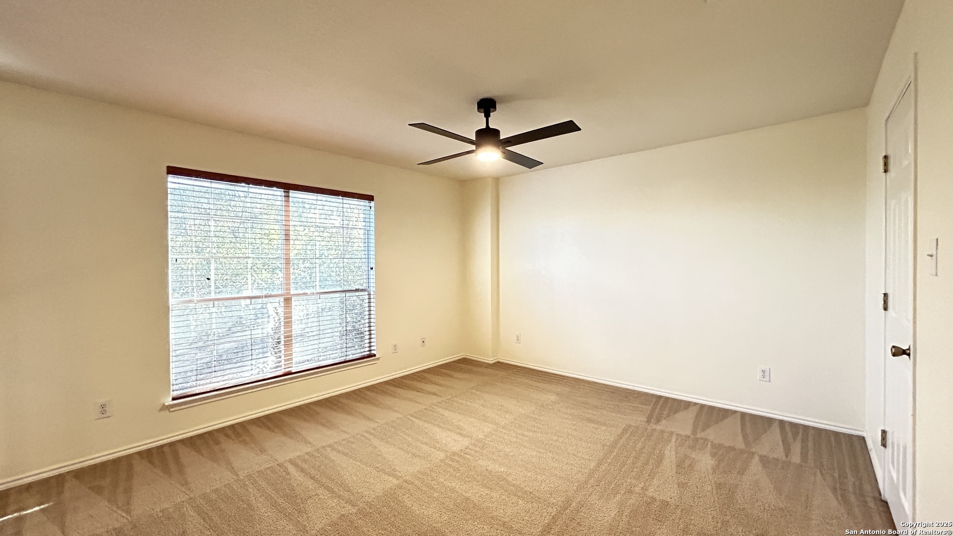 11015 Mustang Spring San Antonio, TX 78254 - Photo 12 of 29 an empty room with fan and windows