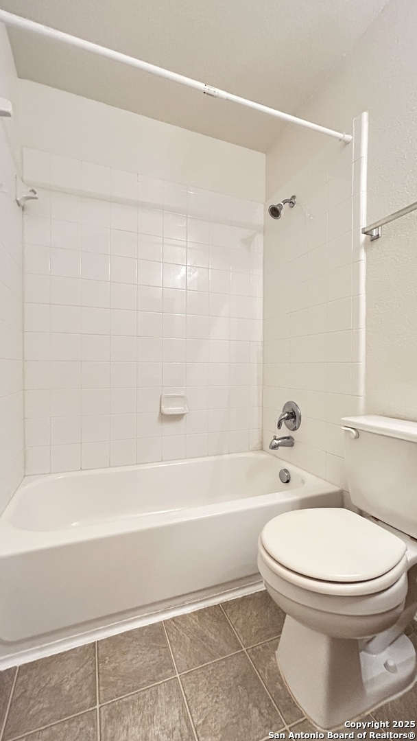 11015 Mustang Spring San Antonio, TX 78254 - Photo 23 of 29 a bathroom with a toilet and a shower