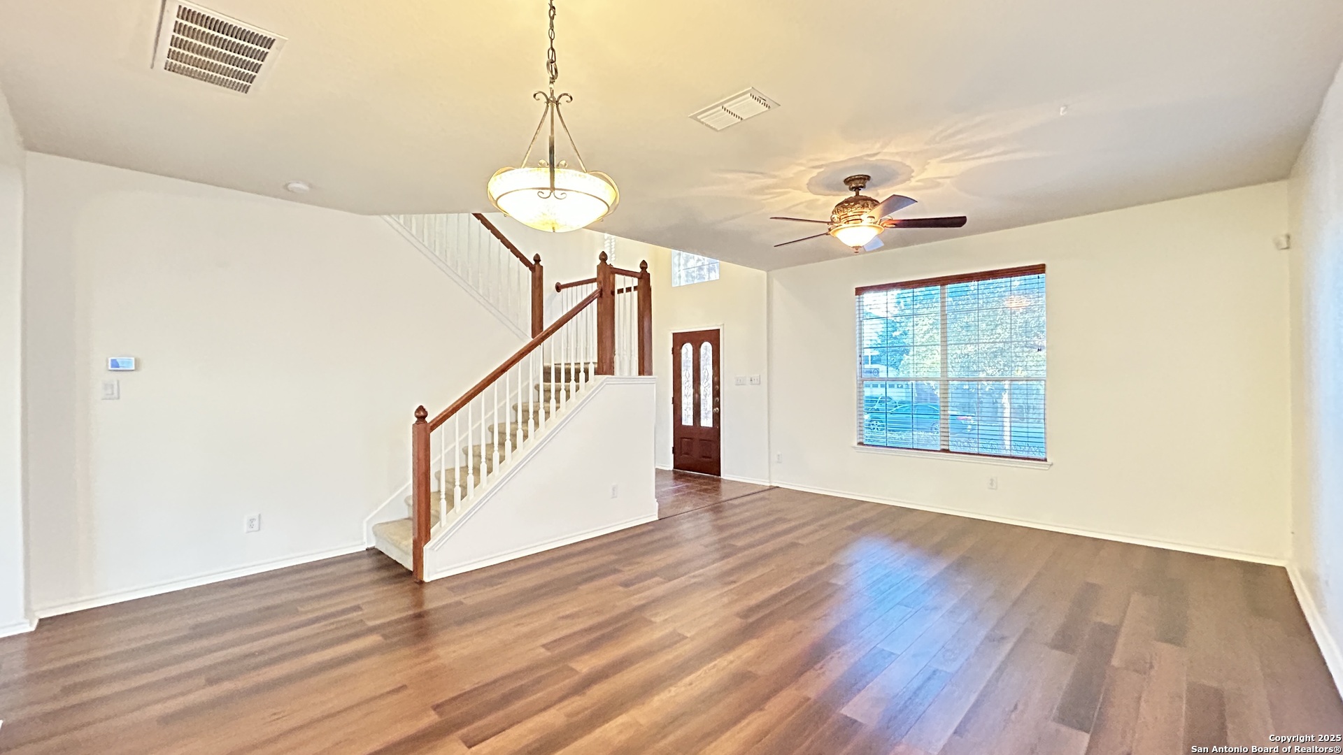 11015 Mustang Spring San Antonio, TX 78254 - Photo 3 of 29 a view of an entryway with wooden floor