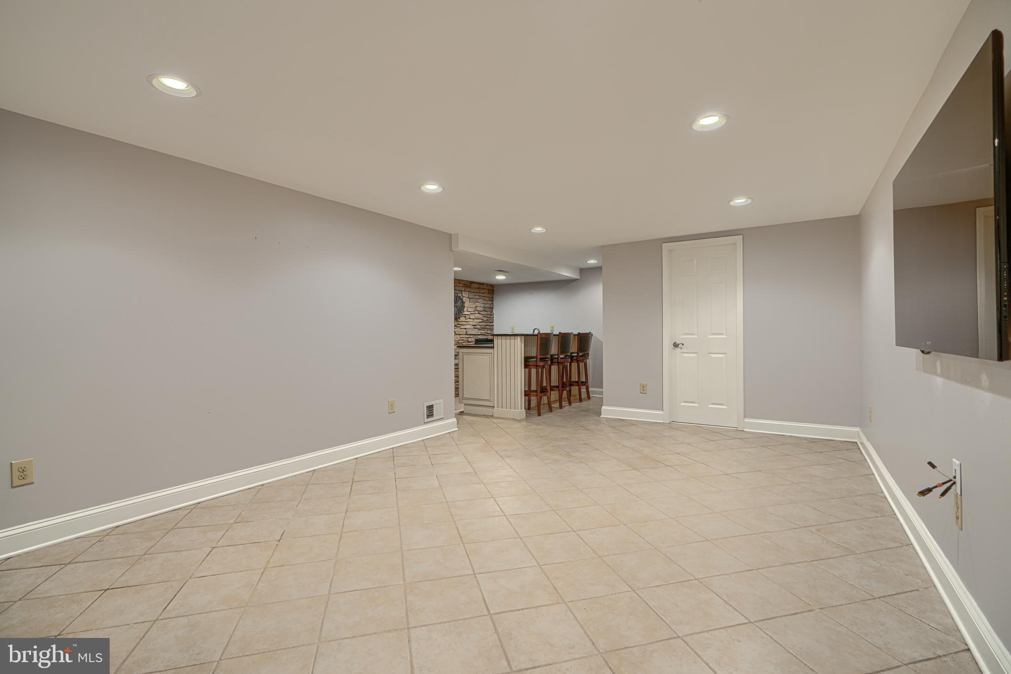13908 Foxland Road Phoenix, MD 21131 - Photo 36 of 49 Lower-level family/rec room with wet bar