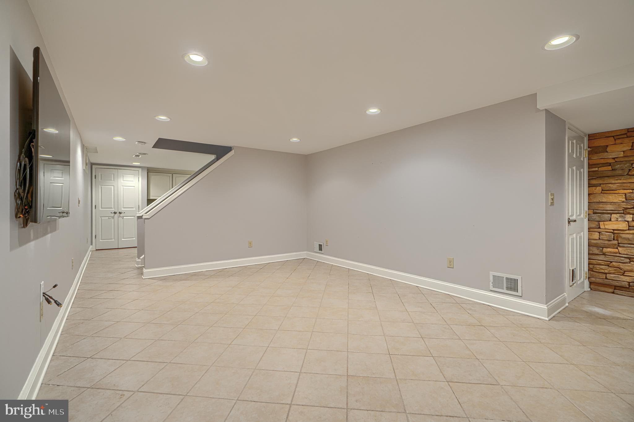 13908 Foxland Road Phoenix, MD 21131 - Photo 37 of 49 Lower-level family/rec room with wet bar