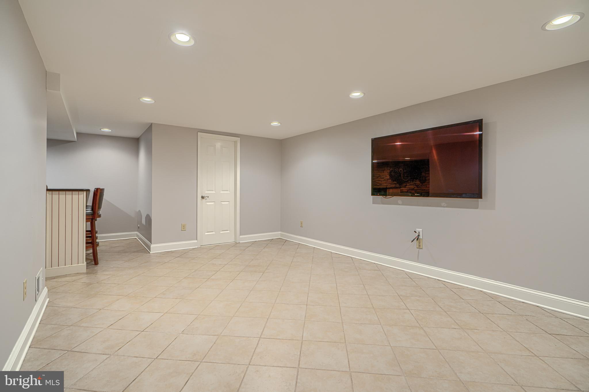13908 Foxland Road Phoenix, MD 21131 - Photo 38 of 49 Lower-level family/rec room with wet bar