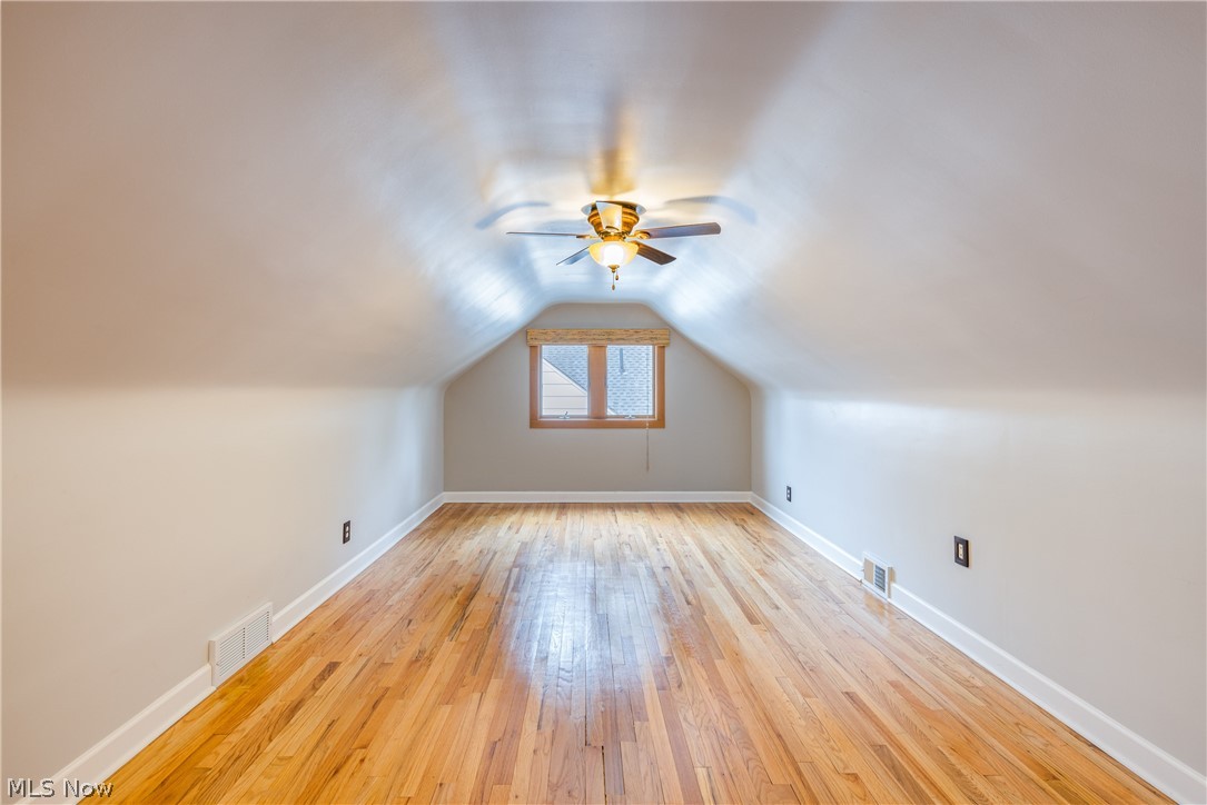 29220 Ridge Road Wickliffe, OH 44092 - Photo 9 of 34 Additional living space featuring ceiling fan, light hardwood / wood-style floors, and lofted ceiling