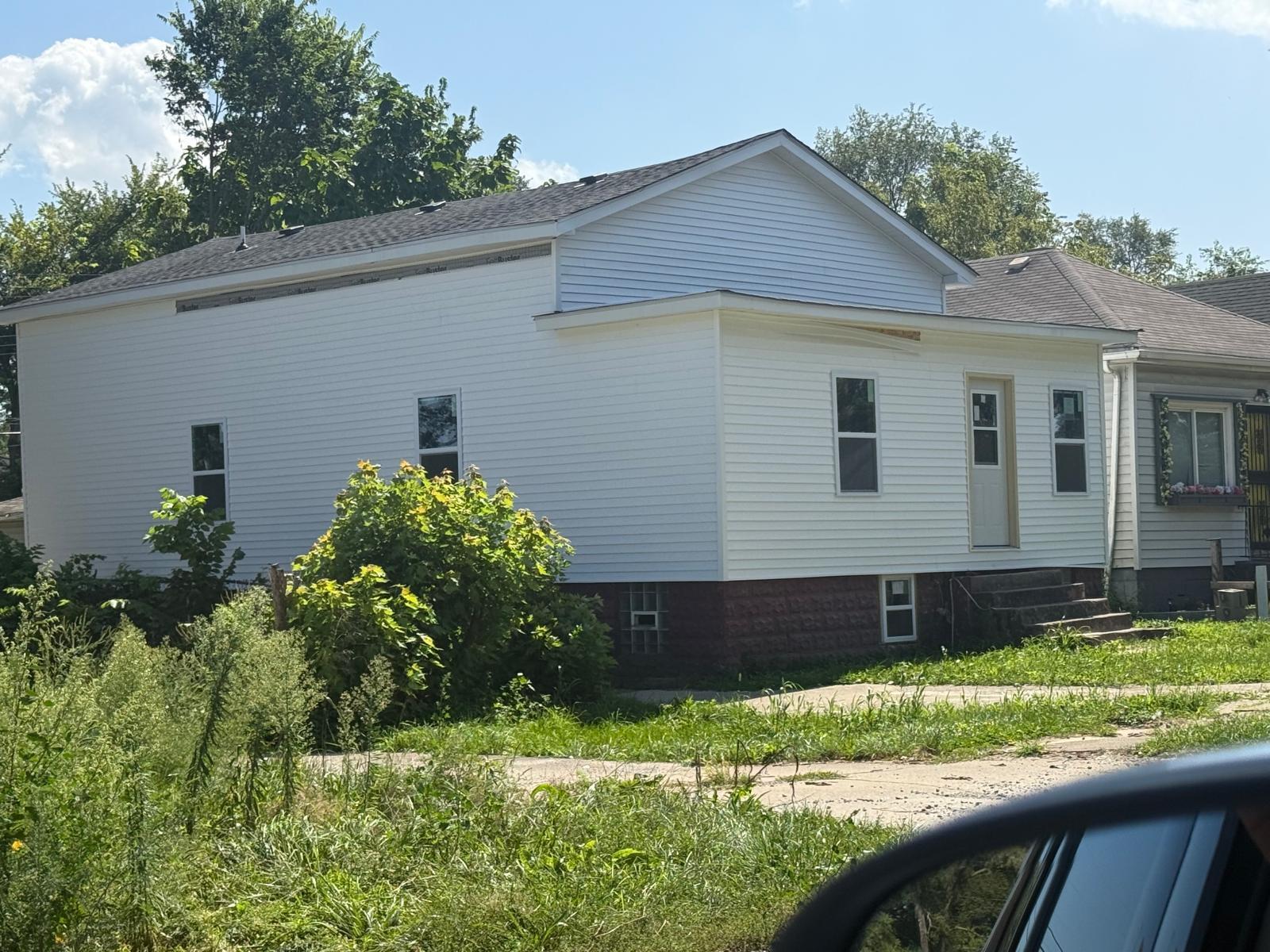 1201 Rutledge Street Gary, IN 46404 - Photo 2 of 6 a front view of a house with a yard