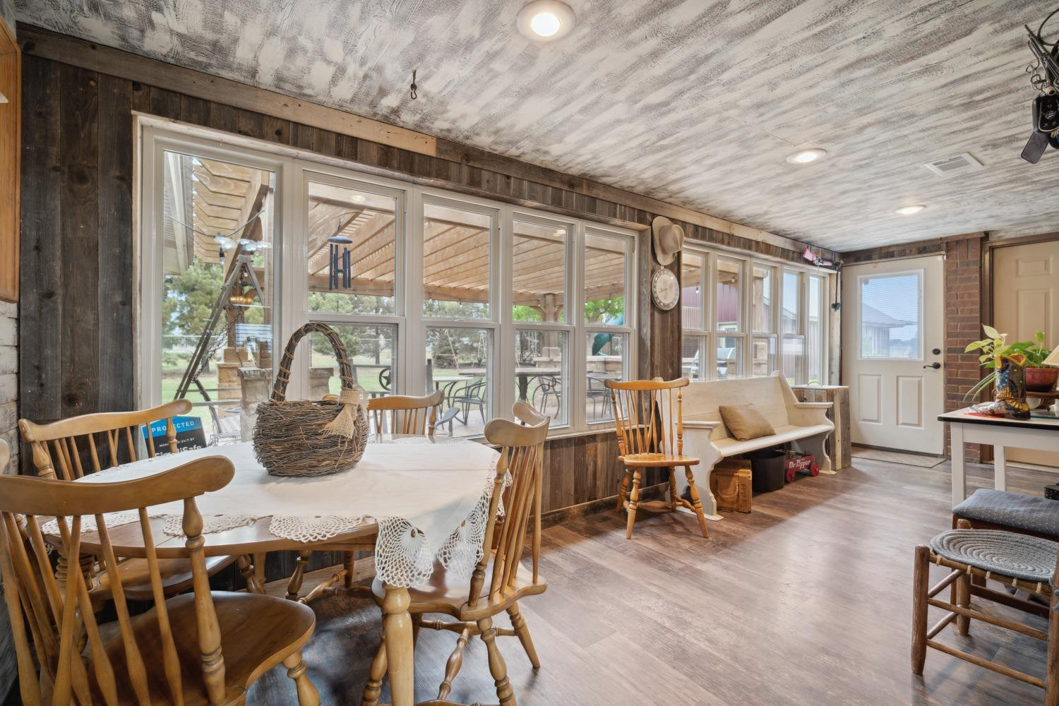 9002 Woodrow Road Wolfforth, TX 79382 - Photo 15 of 48 a dining room with furniture window and wooden floor