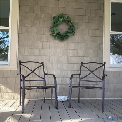 a view of a wooden bench and bench in front of a door