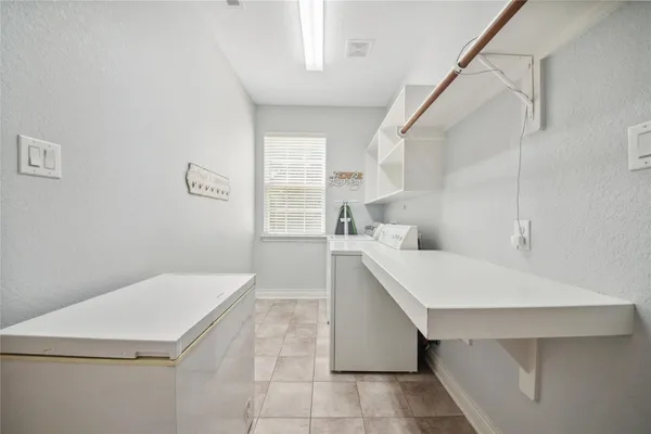 a kitchen with a cabinets and window