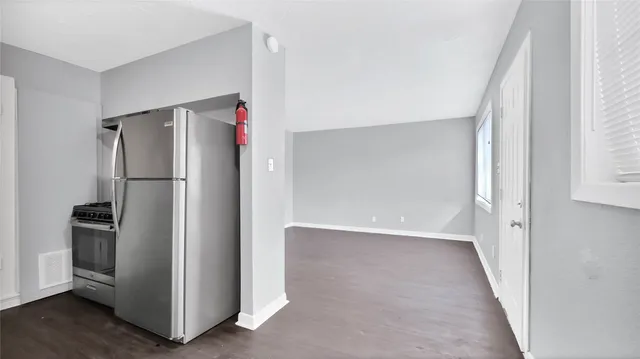 a view of a refrigerator in a kitchen