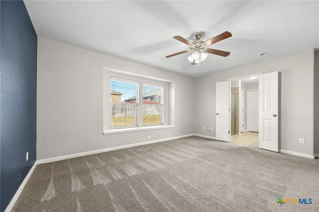 a view of an empty room with a window