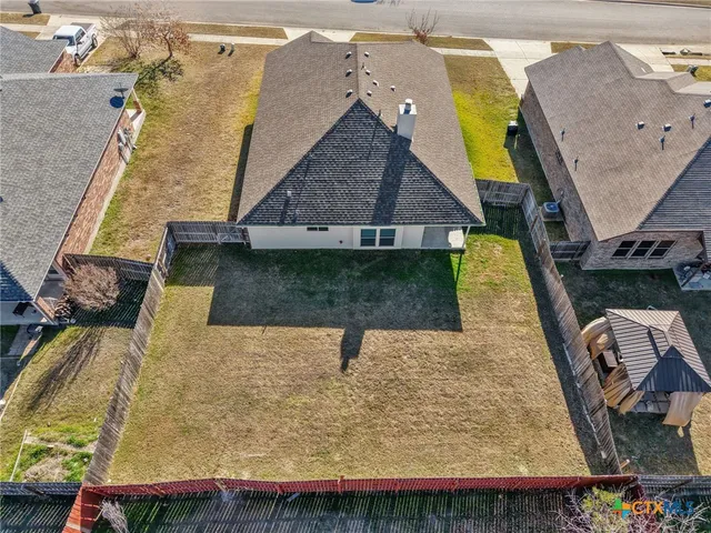 a aerial view of a house with swimming pool