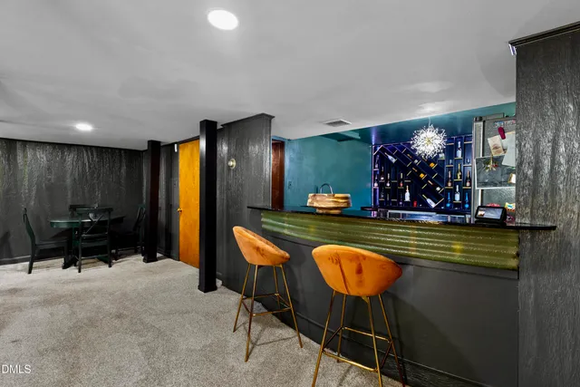 a view of a living room and dining area