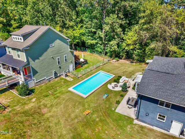 an aerial view of a house with swimming pool
