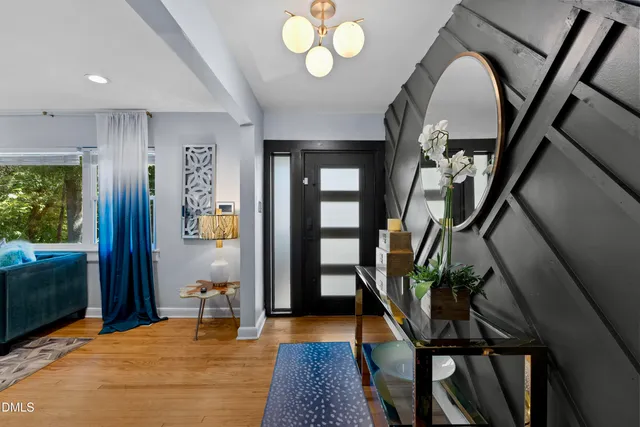 a view of an entryway with wooden floor
