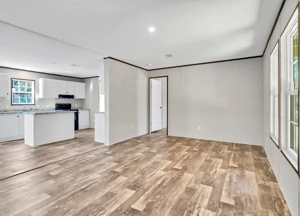 a view of a kitchen with a sink and a refrigerator