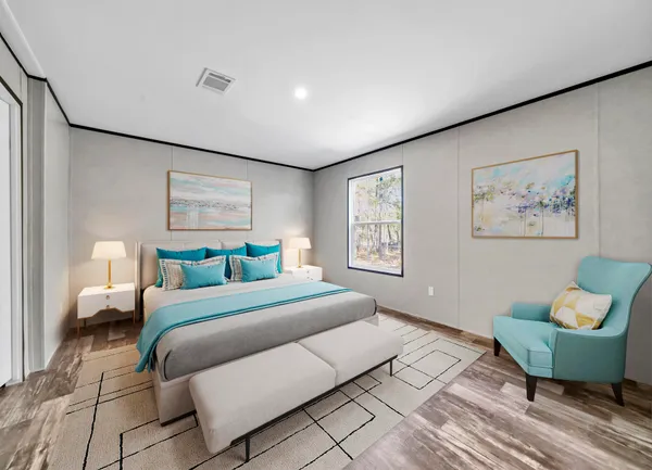 a bedroom with a bed and a couch