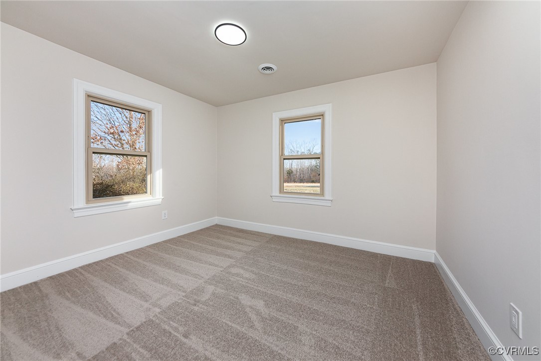 9810 Cross County Road Mineral, VA 23117 - Photo 12 of 23 Carpeted empty room featuring a healthy amount of