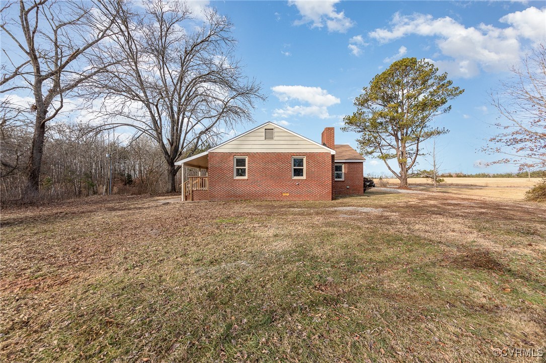 9810 Cross County Road Mineral, VA 23117 - Photo 23 of 23 View of side of property with a lawn