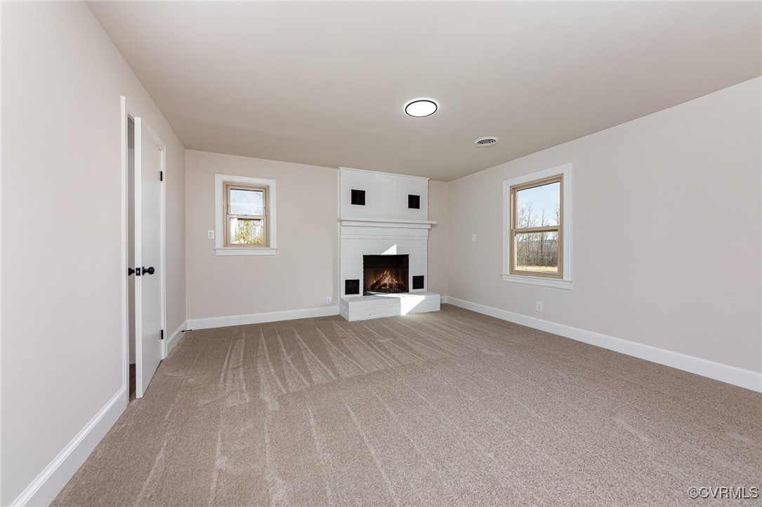 9810 Cross County Road Mineral, VA 23117 - Photo 5 of 23 Unfurnished living room with a fireplace and light