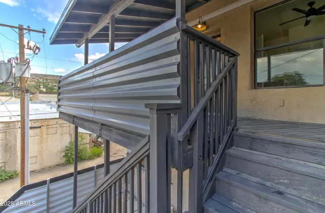 a view of a balcony with staircase