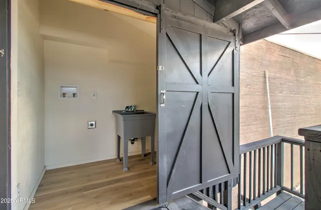 a view of room with furniture and wooden floor