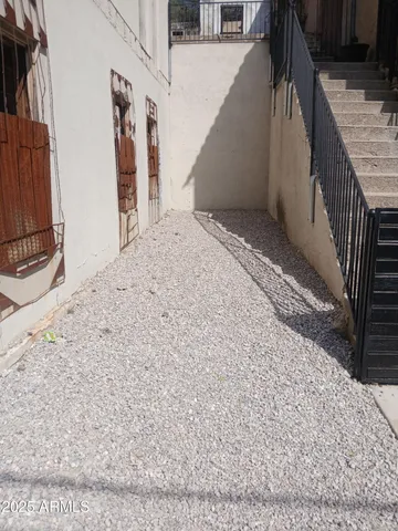 a house with wooden door and outdoor space