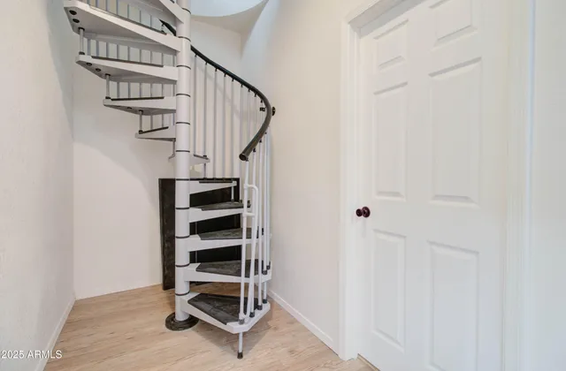 a view of entryway with stairs and wooden floor