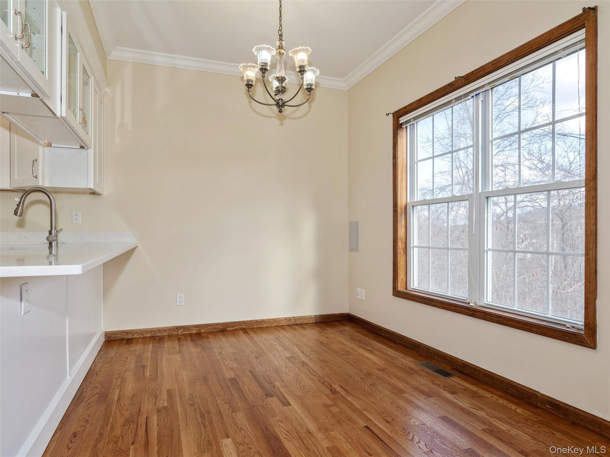 43 Aveonis Court Fishkill, NY 12524 - Photo 7 of 37 Dining area with large window overlooking the mountains, chandelier