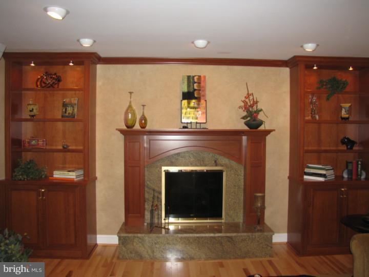 217 Sandringham Road Cherry Hill, NJ 08003 - Photo 11 of 25 a living room with furniture and a fireplace