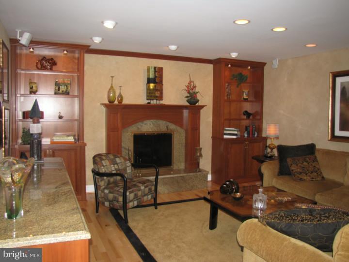 217 Sandringham Road Cherry Hill, NJ 08003 - Photo 12 of 25 a living room with furniture and a fireplace