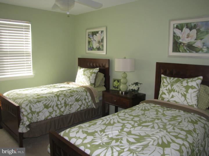 217 Sandringham Road Cherry Hill, NJ 08003 - Photo 17 of 25 a bedroom with a bed and painting on the wall