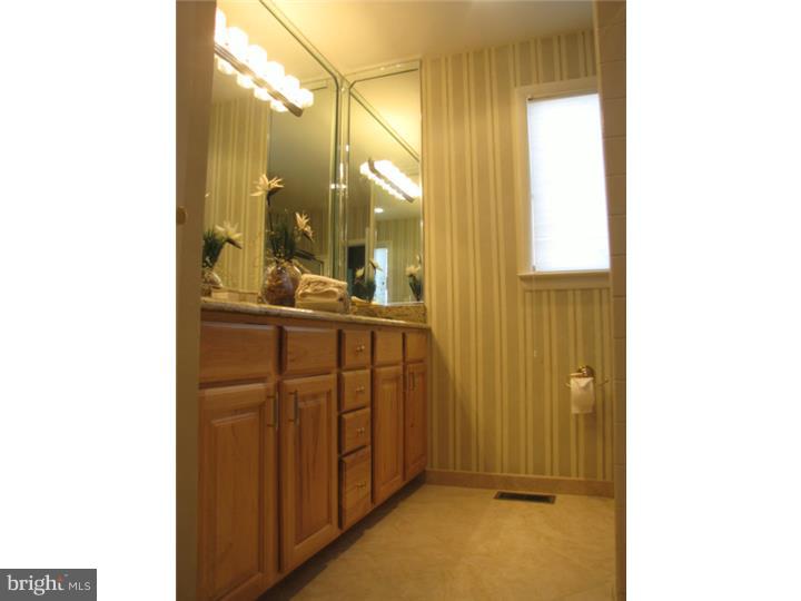 217 Sandringham Road Cherry Hill, NJ 08003 - Photo 20 of 25 a bathroom with a sink and mirror