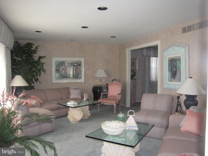 217 Sandringham Road Cherry Hill, NJ 08003 - Photo 3 of 25 a living room with furniture and a table