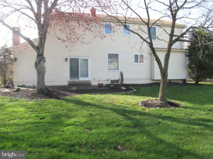217 Sandringham Road Cherry Hill, NJ 08003 - Photo 24 of 25 a front view of a house with a yard