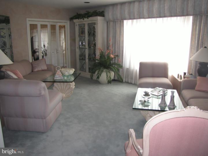 217 Sandringham Road Cherry Hill, NJ 08003 - Photo 4 of 25 a living room with furniture and a large window