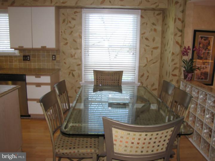 217 Sandringham Road Cherry Hill, NJ 08003 - Photo 9 of 25 a view of entryway with wooden floor