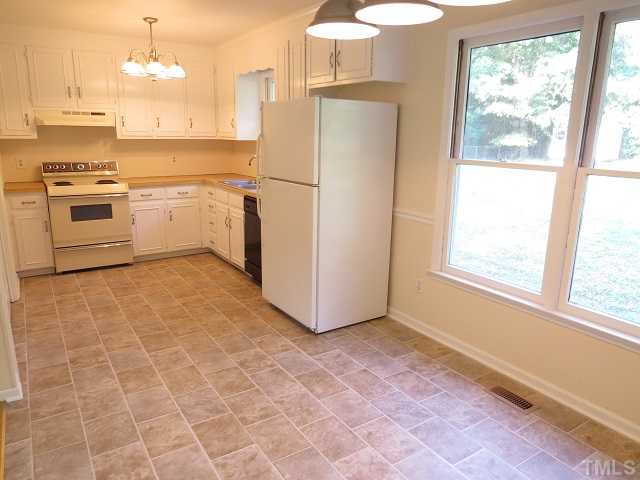 1504 Old Maple Drive Raleigh, NC 27610 - Photo 5 of 20 Kitchen with new vinyl flooring.