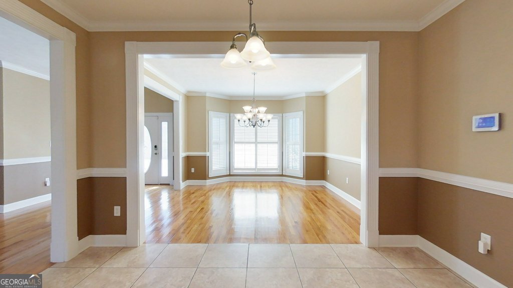101 Willow Ridge Circle Thomasville, GA 31757 - Photo 19 of 92 a view of a room with wooden floor and large windows