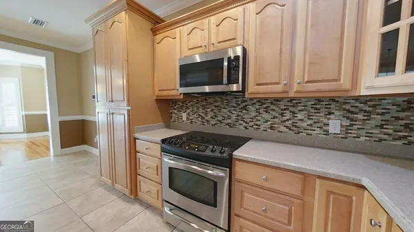 a spacious bathroom with a double vanity sink and a mirror