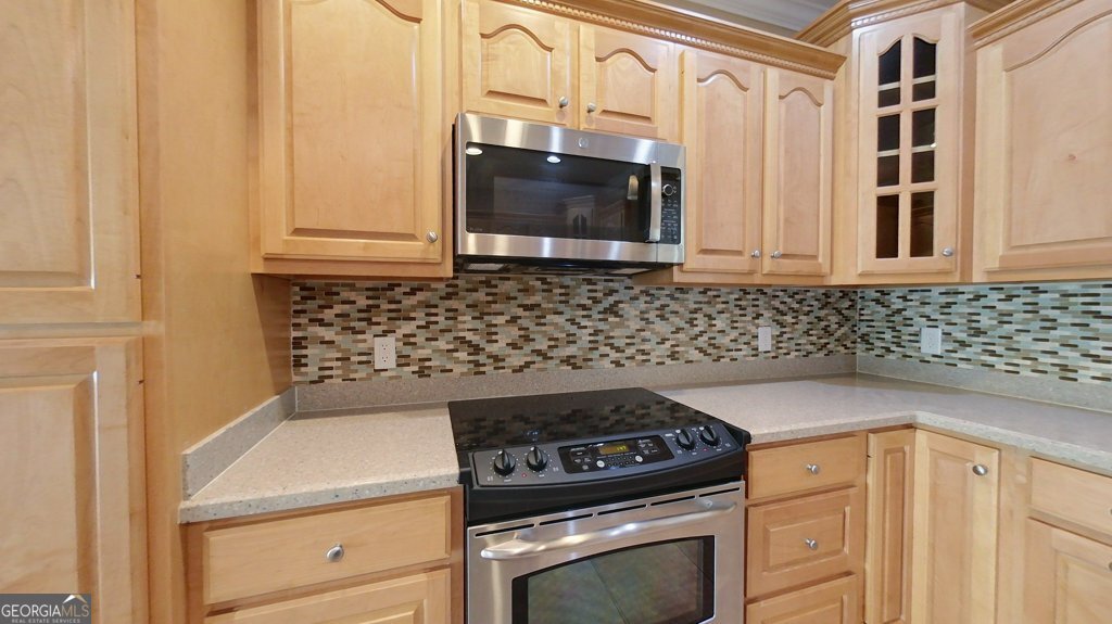 101 Willow Ridge Circle Thomasville, GA 31757 - Photo 26 of 92 a kitchen with granite countertop white cabinets and stainless steel appliances