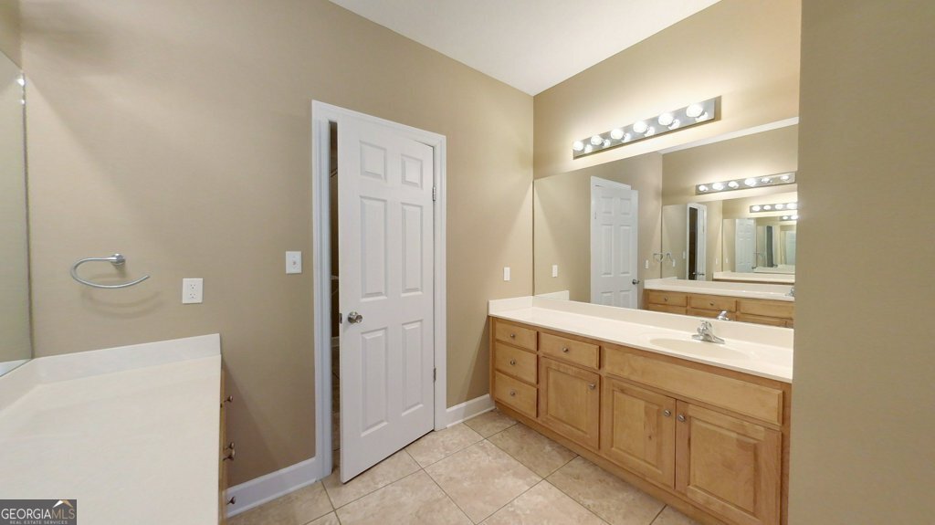101 Willow Ridge Circle Thomasville, GA 31757 - Photo 36 of 92 a spacious bathroom with a double vanity sink a mirror and a shower