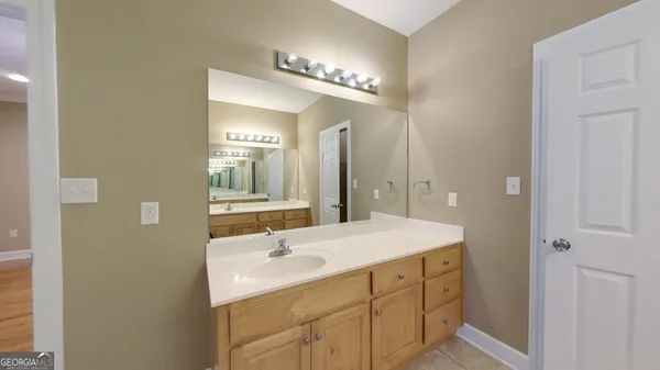 a view of an empty room with a bathroom