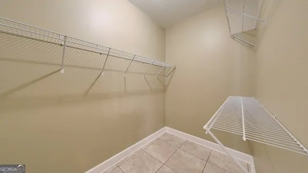 a bathroom with a shower and a shower head