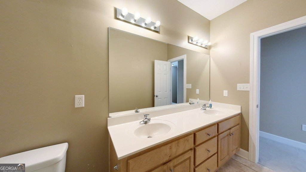 101 Willow Ridge Circle Thomasville, GA 31757 - Photo 61 of 92 a bathroom with a double vanity sink and a mirror