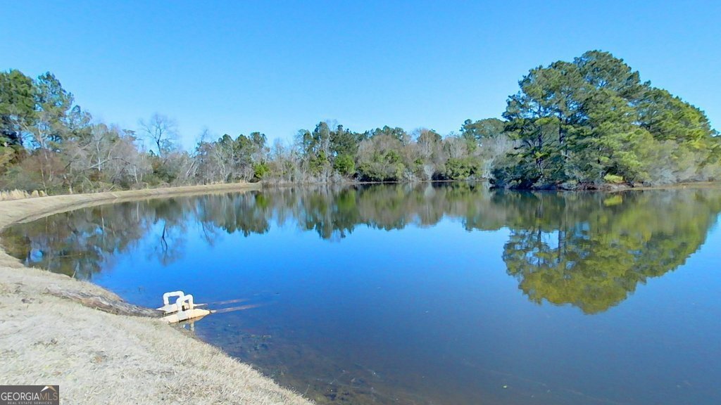 101 Willow Ridge Circle Thomasville, GA 31757 - Photo 89 of 92 a view of a lake in between two chairs