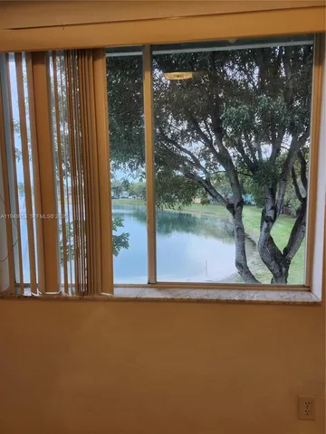 a view of a back yard from a balcony