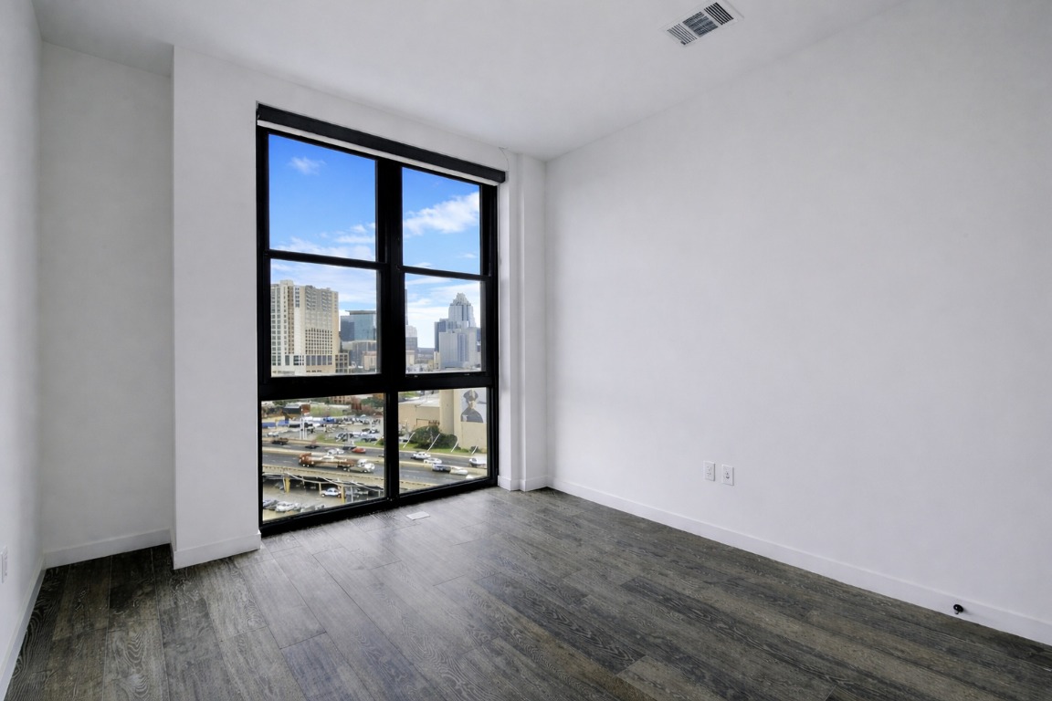 800 Embassy Drive, Unit 606 Austin, TX 78702 - Photo 23 of 38 wooden floor in an empty room