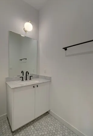 a bathroom with a sink and vanity
