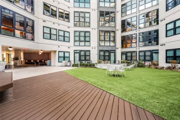 a view of a building with a yard