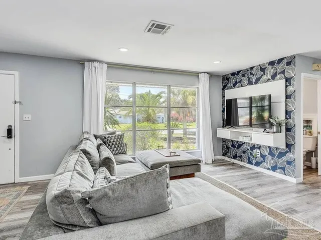a living room with furniture and a large window