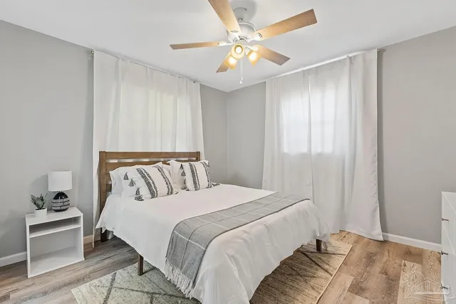 a bed room with a bed and a chandelier